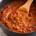 Plate of Spaghetti with Meat Sauce garnished with fresh herbs