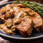 Delicious Southern Meatloaf topped with rich brown gravy, perfect comfort food.